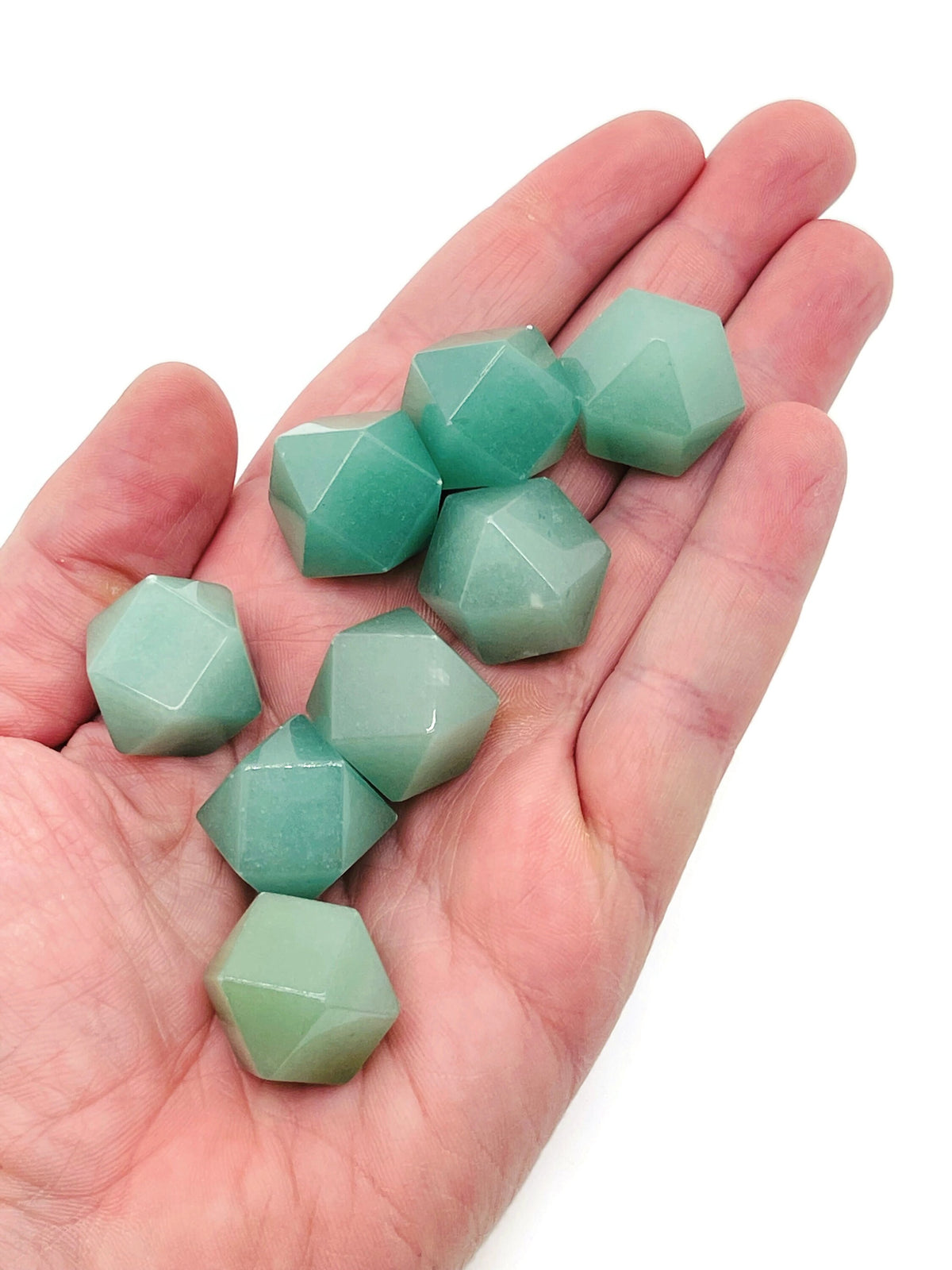 20mm aventurine polyhedron carved gemstone from GemstoneGO, showcasing its green, translucent, faceted geometric shape.