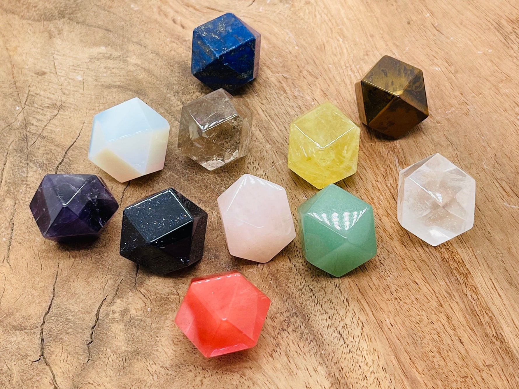 20mm Polyhedron carved gemstone from GemstoneGO, featuring vibrant mixed crystal healing stones with intricate geometric facets.