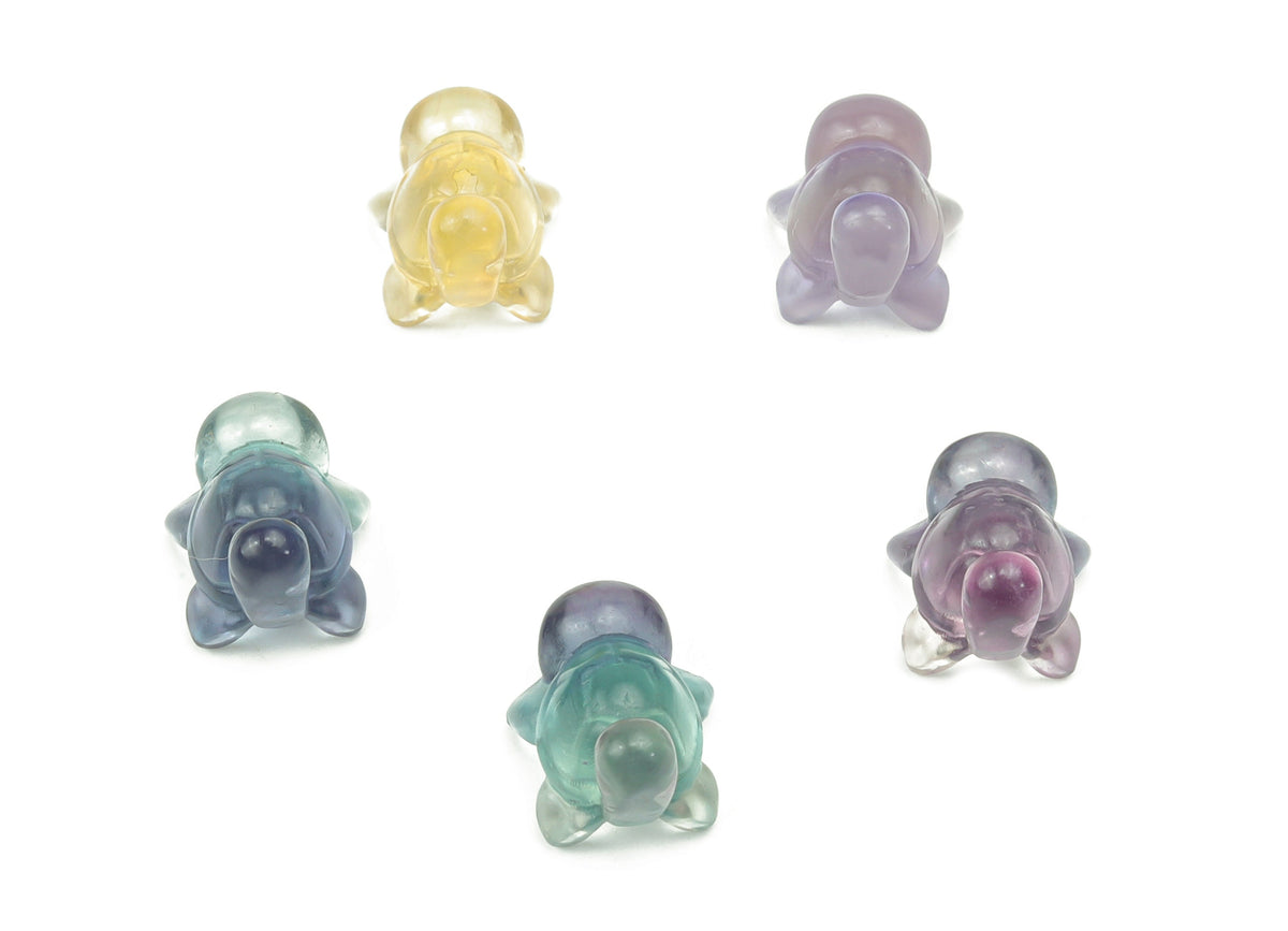 Fluorite tortoise gemstone carving by GemstoneGO showing a colorful, polished turtle-shaped ornament with vibrant purple, green, and blue hues.
