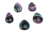 Polished fluorite crystal carving gemstone from GemstoneGO, showing vibrant purple, green, and blue hues with smooth, detailed craftsmanship.