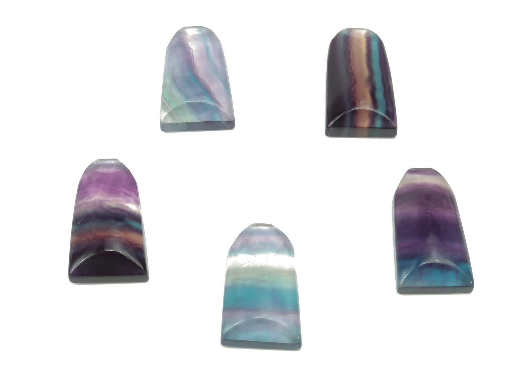 Fluorite flat tower gemstone carving in vibrant purple and green hues, showcasing intricate craftsmanship and smooth polished surface.
