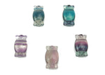 Fluorite candy carving gemstone from GemstoneGO with vibrant purple and green hues, showcasing intricate carving details.