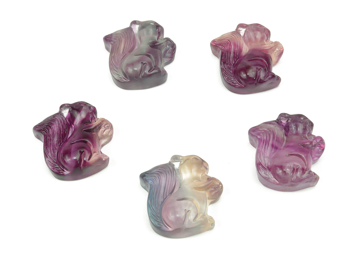 Colorful fluorite squirrel gemstone carving by GemstoneGO, detailed, polished mineral sculpture showcasing vibrant hues and intricate design.