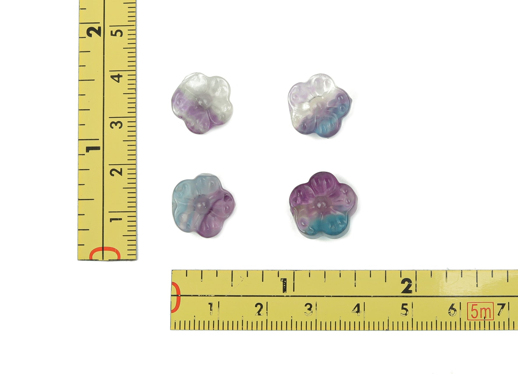 Mini Fluorite flower carving gemstone by GemstoneGO showcasing vibrant purple and green hues with intricate floral details.