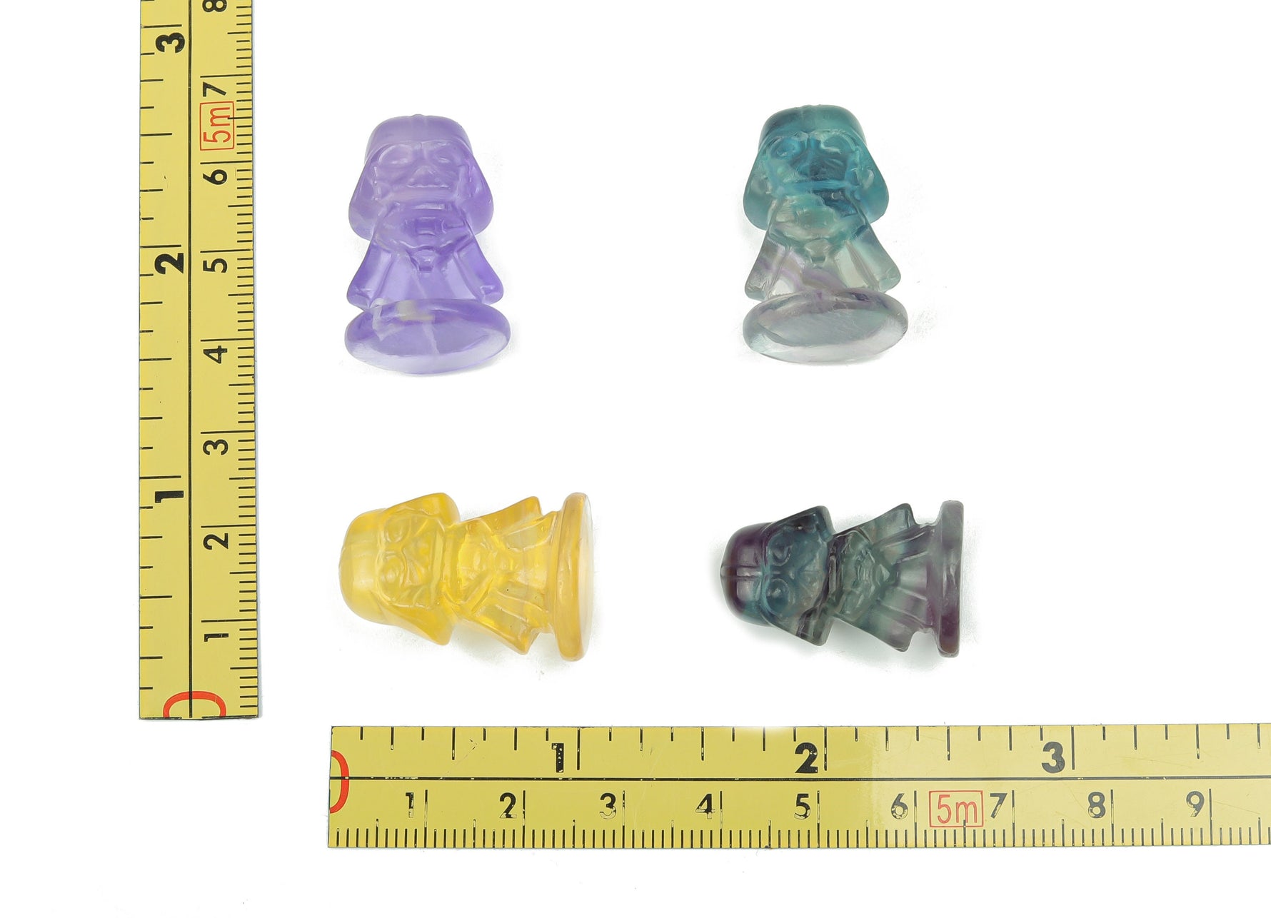 Fluorite Darth Vader carving gemstone from GemstoneGO, detailed dark green and purple mineral sculpture of Darth Vader's helmet.