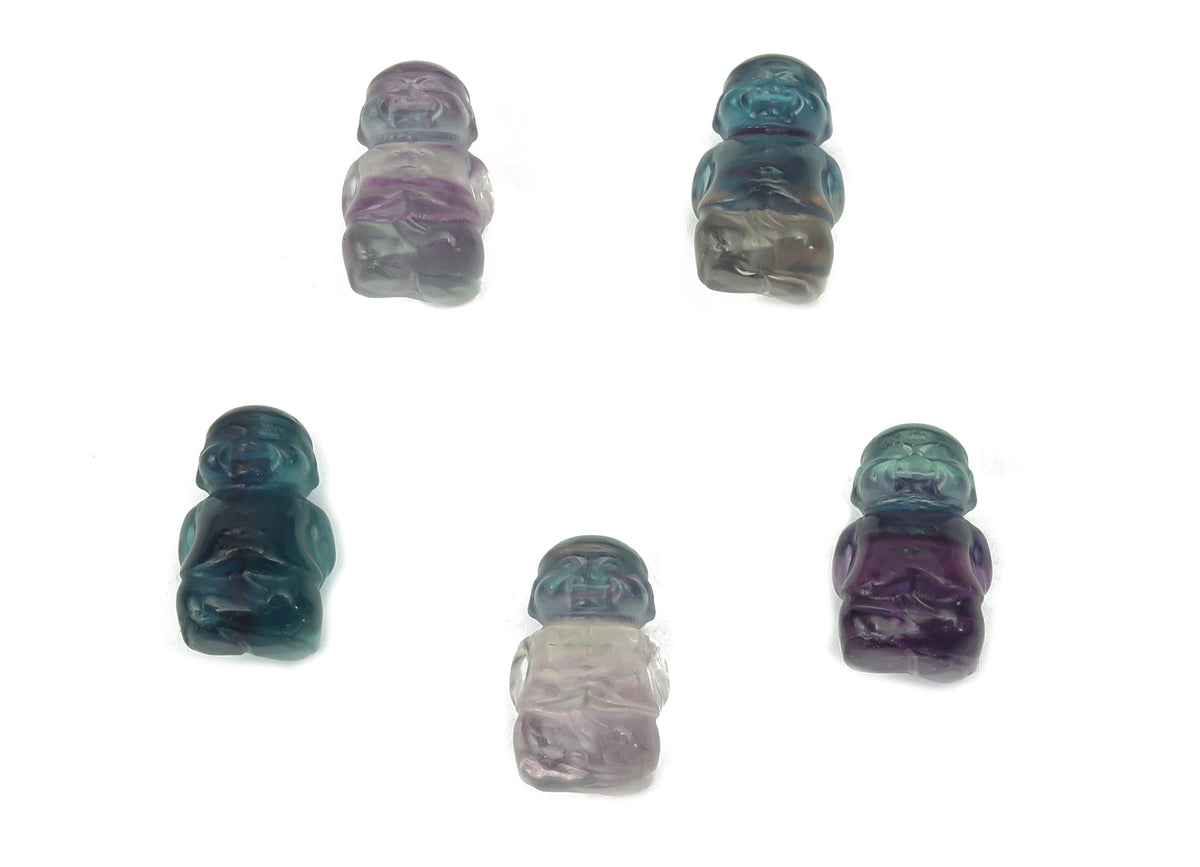 Small fluorite crystal carving gemstone by GemstoneGO, showcasing vibrant purple, green, and blue hues with polished finish.