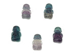 Small fluorite crystal carving gemstone by GemstoneGO, showcasing vibrant purple, green, and blue hues with polished finish.