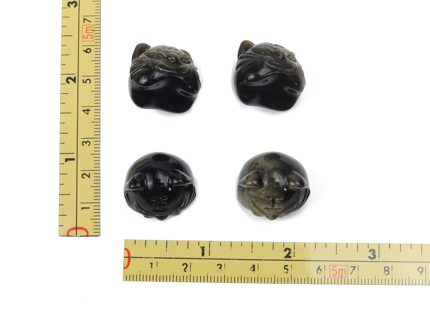Golden sheen obsidian cat carving gemstone with polished finish, showcasing detailed feline shape and rich golden reflective surface.