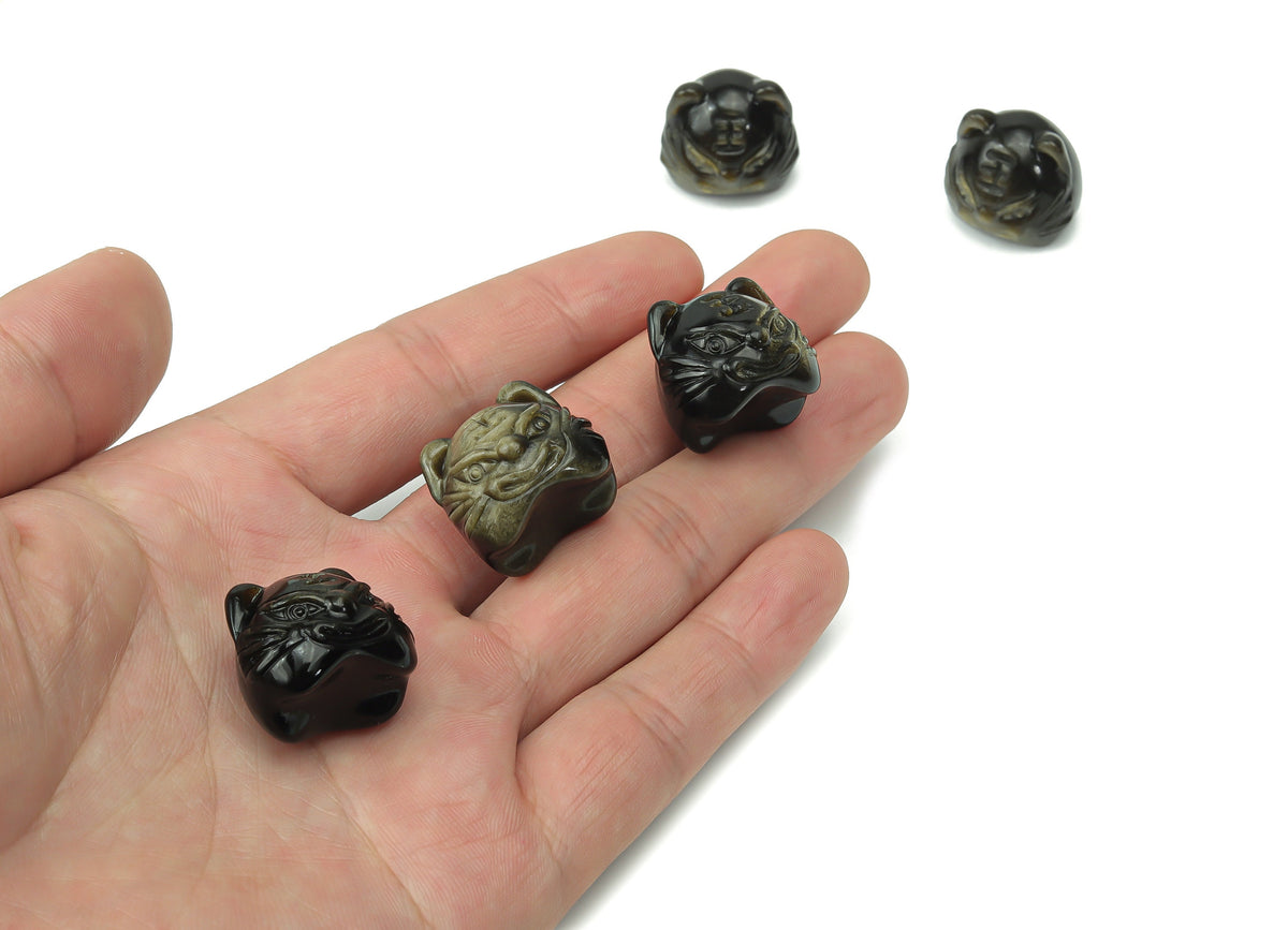 Golden sheen obsidian cat carving gemstone from GemstoneGO, showcasing a detailed, polished feline figure with a rich golden luster.