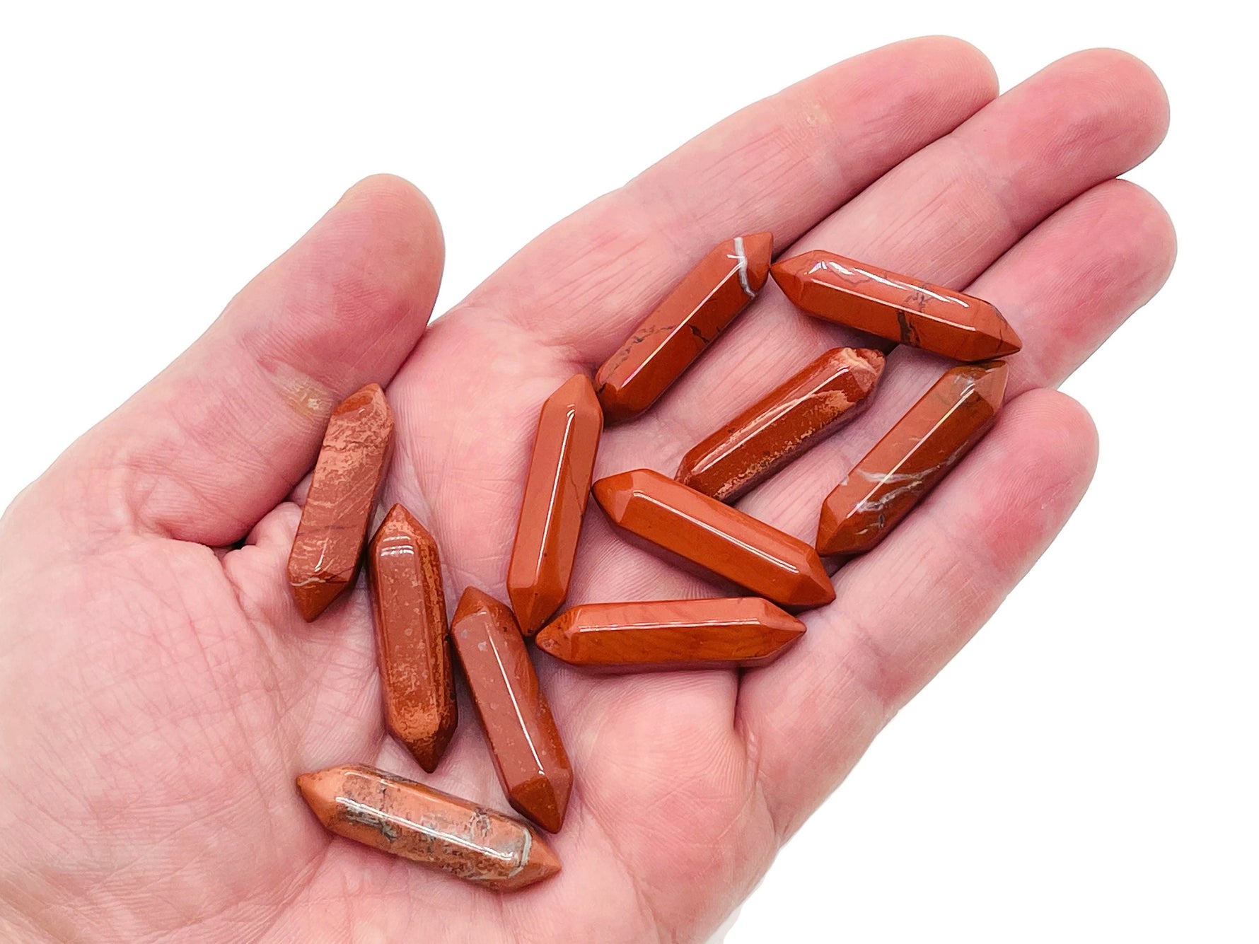 Red Jasper terminated carved point gemstone from GemstoneGO, 33mm, featuring a polished, natural red jasper mineral specimen.