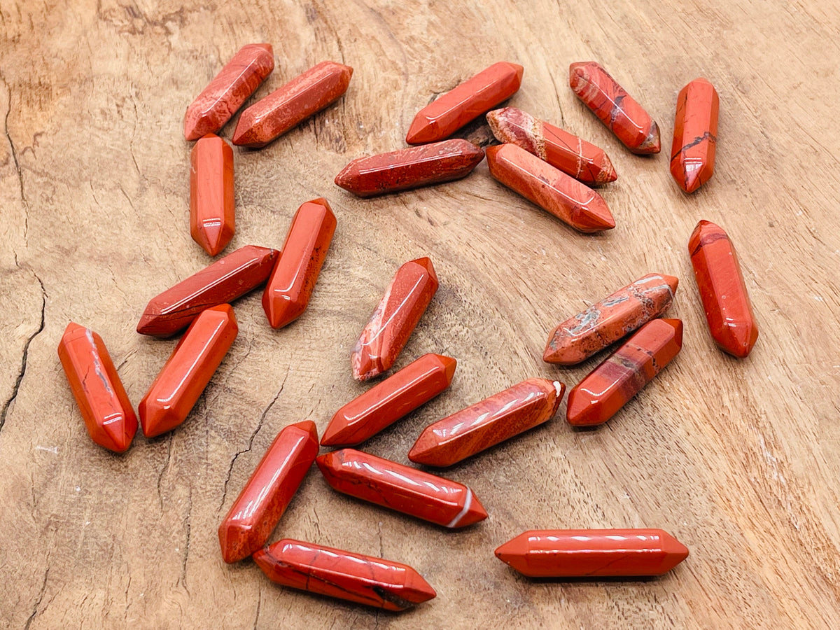 Red Jasper terminated carved point gemstone from GemstoneGO, 33mm, showcasing polished red jasper with natural carved details.
