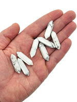 Howlite terminated carved point gemstone in 33mm size, featuring smooth white stone with gray veining, from GemstoneGO.