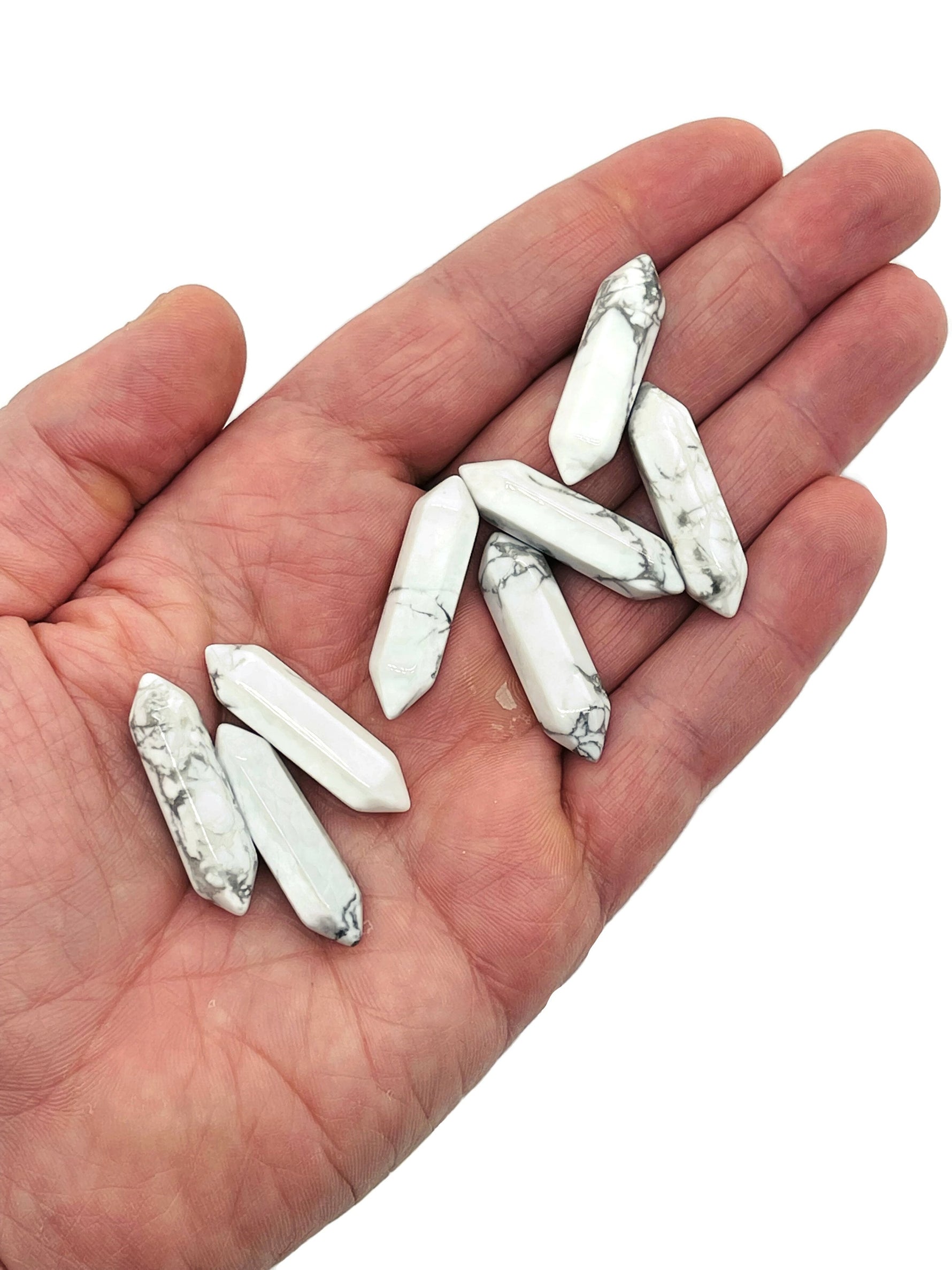 Howlite terminated carved point gemstone in 33mm size, featuring smooth white stone with gray veining, from GemstoneGO.