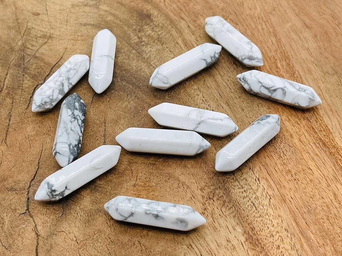 Howlite terminated carved point gemstone, 33mm, from GemstoneGO, showcasing a smooth, polished white and gray stone with natural veining.