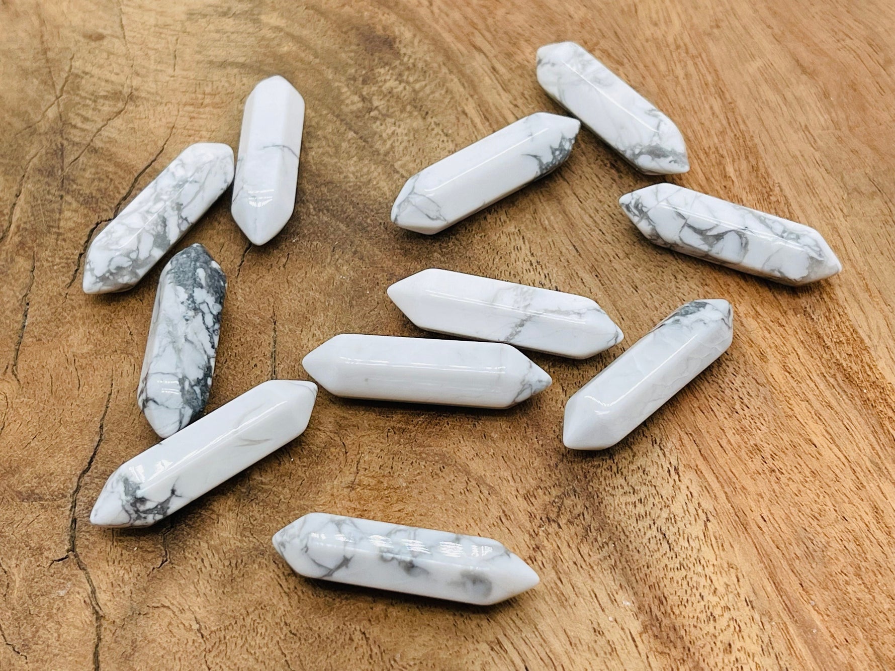 Howlite terminated carved point gemstone, 33mm, from GemstoneGO, showcasing a smooth, polished white and gray stone with natural veining.