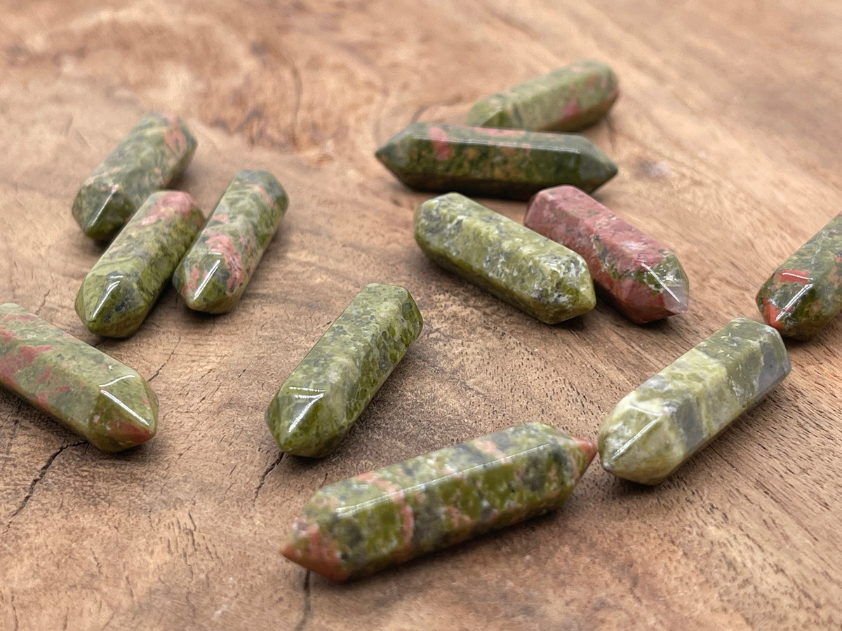 Unakite terminated carved gemstone point, 33mm, from GemstoneGO, showing vibrant green and pink mineral patterns with polished surfaces.