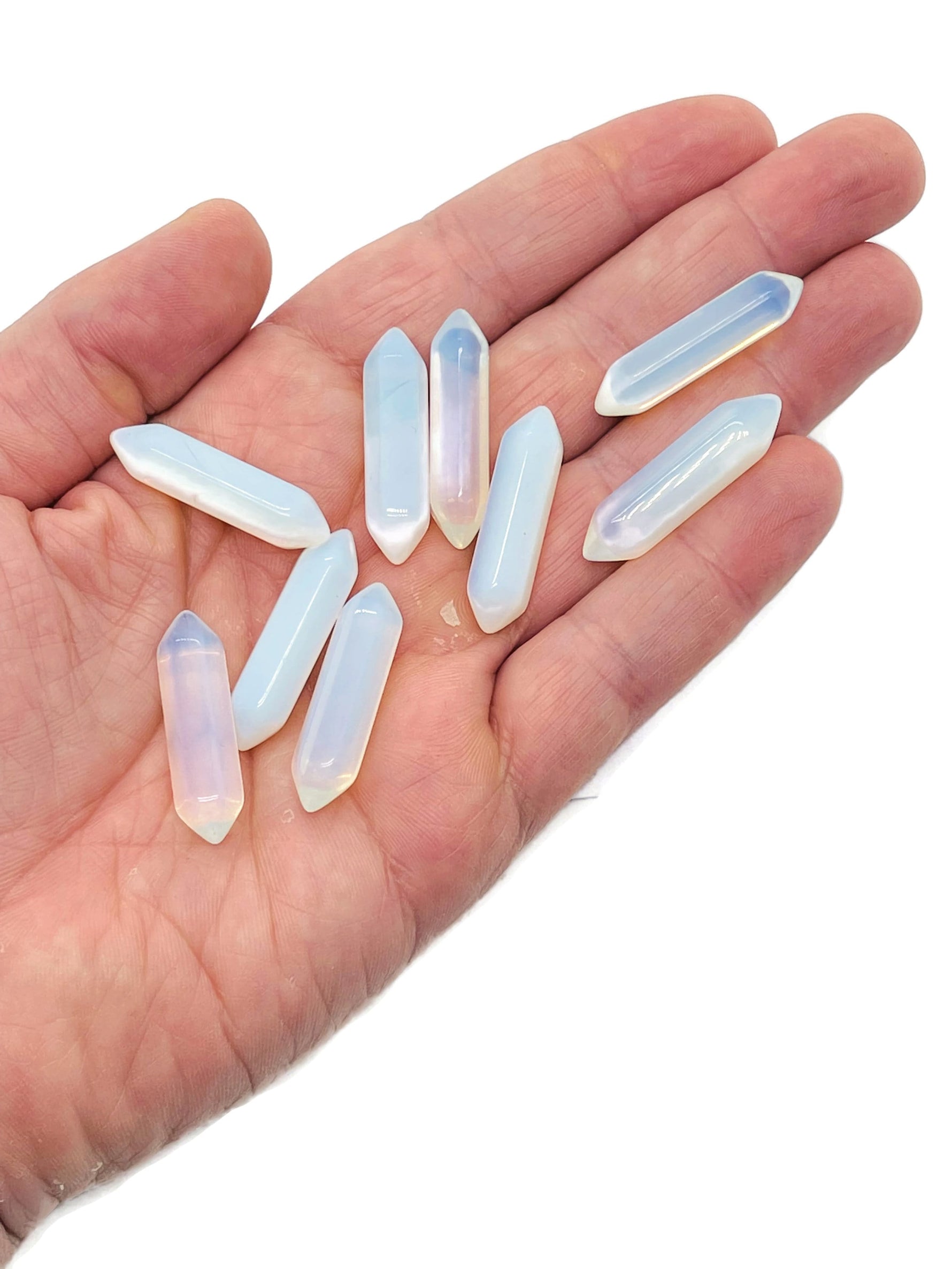 Opalite terminated carved point gemstone from GemstoneGO, 33mm, featuring smooth, polished surface with natural translucence and unique carvings.