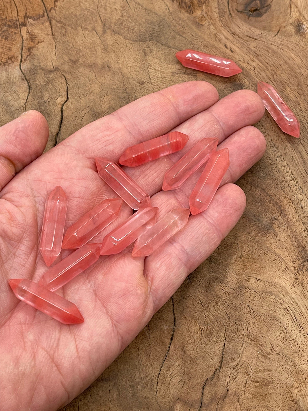 Cherry Quartz terminated carved point gemstone from GemstoneGO, 33mm, showcasing its vibrant red color and detailed carving.