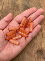 Orange Cats Eye gemstone carved point, 33mm, with vibrant orange color and eye-catching carved pattern, from GemstoneGO.
