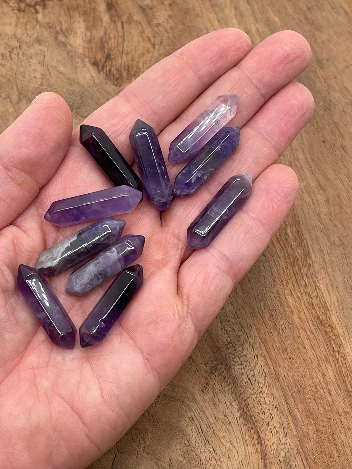 Amethyst terminated carved point gemstone, 33mm, from GemstoneGO, showcasing purple crystal with natural facets and polished tip.