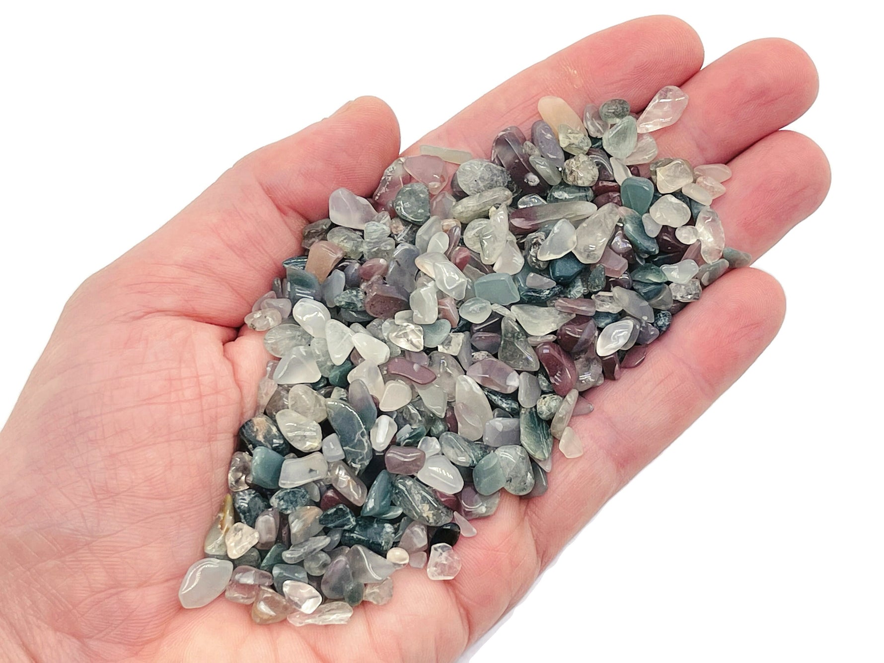 Semi tumbled Indian Agate crystal chips in 5-7mm size from GemstoneGO, displayed in a bulk collection with vibrant natural patterns.