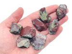 Raw Dragon Blood Jasper gemstone from GemstoneGO, showing deep red and black natural stone with unique patterns and rough texture.