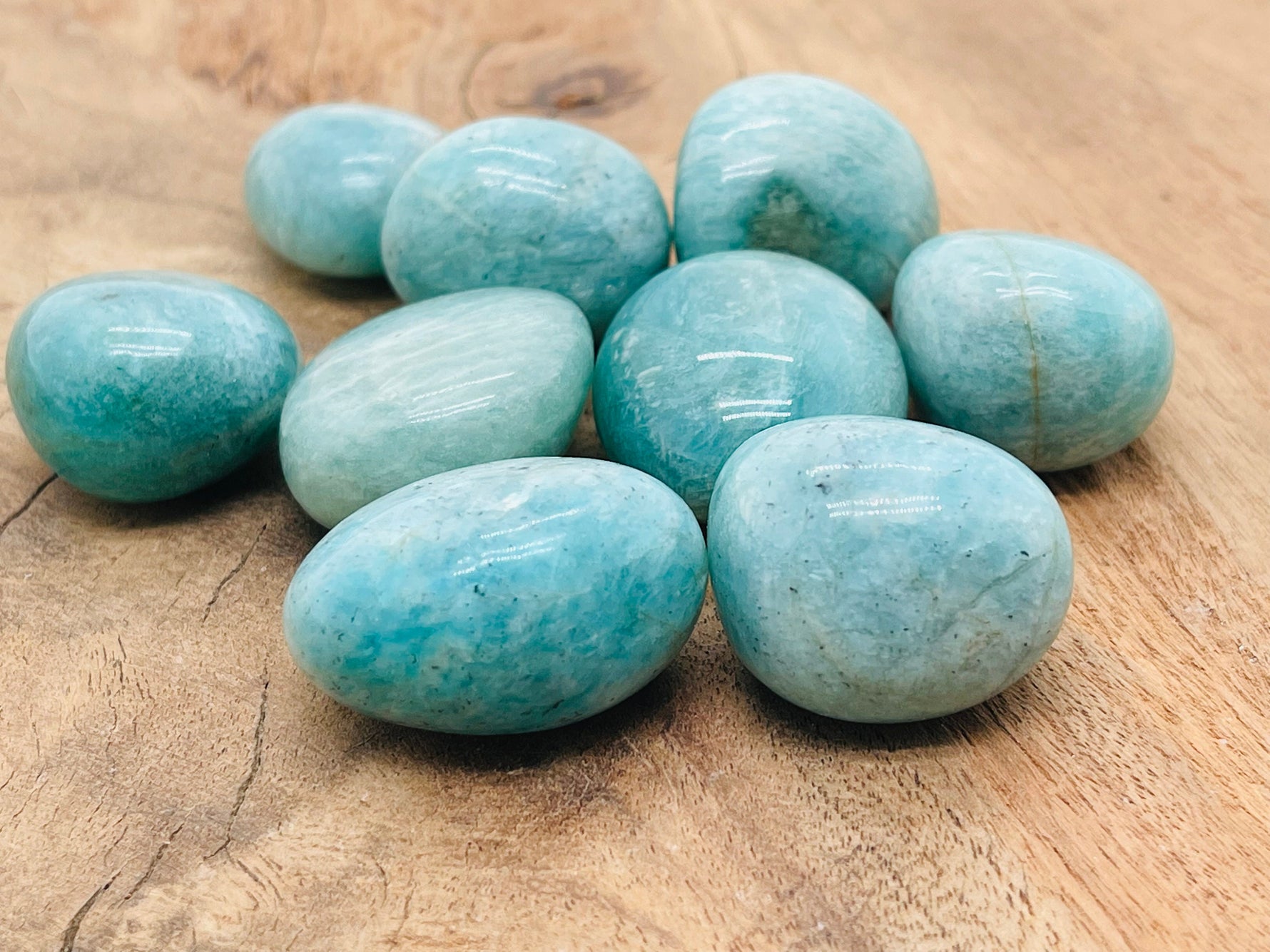 Amazonite tumbled stone from GemstoneGO, smooth blue-green gemstone with natural marbling and polished finish.