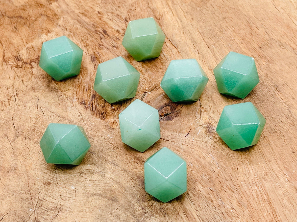 A 20mm aventurine polyhedron carved gemstone from GemstoneGO, showcasing a vibrant green, faceted crystal shape.