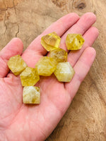 Citrine polyhedron carved gemstone, 20mm, from GemstoneGO, showcasing a vibrant yellow-orange crystal with faceted surface.