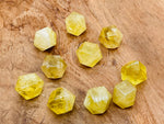 Citrine polyhedron carved gemstone, 20mm, from GemstoneGO, showcasing a vibrant yellow-orange, faceted stone with detailed carving.