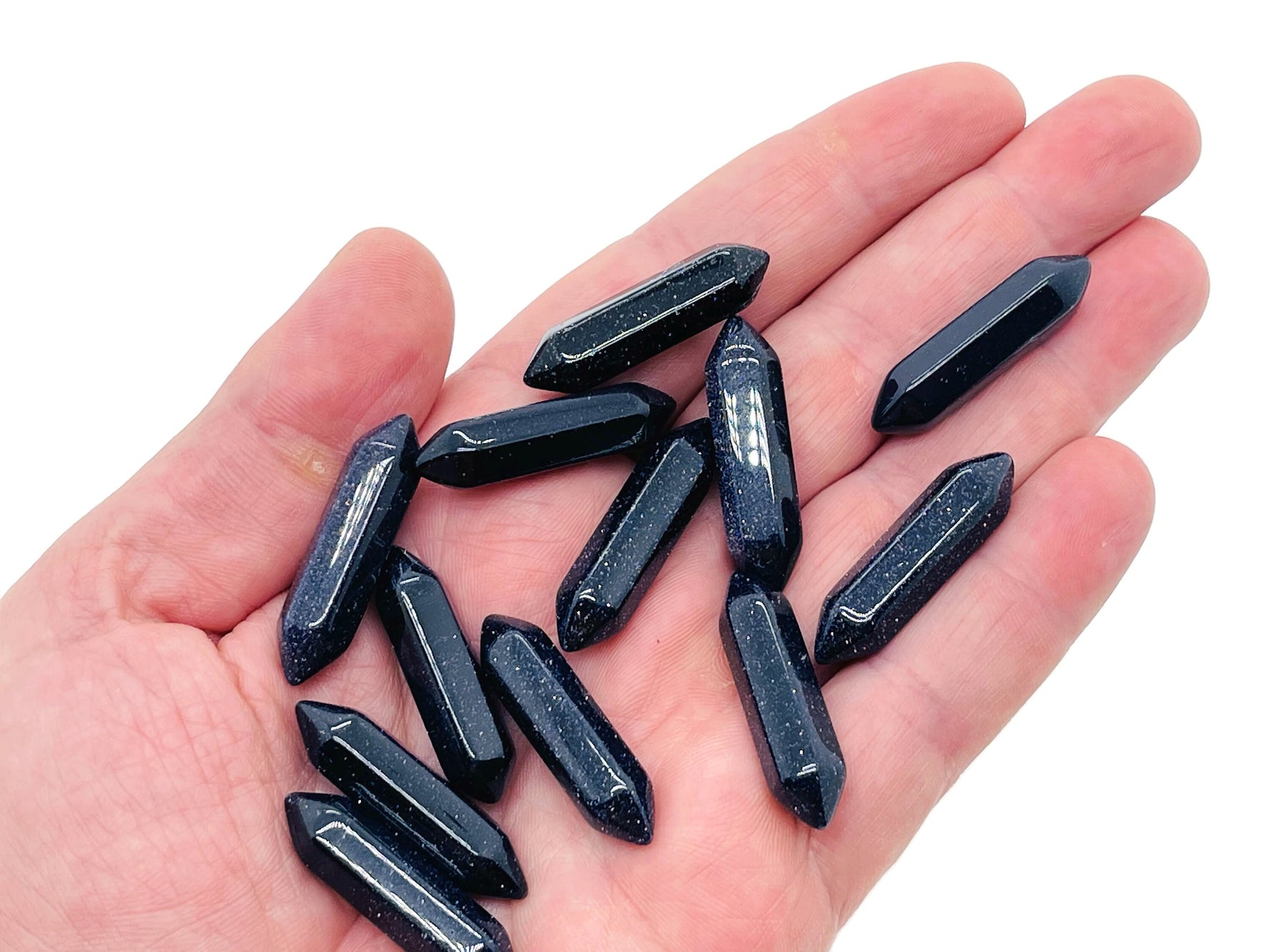 Blue Goldstone carved point gemstone, 33mm terminated pendant from GemstoneGO with polished surface and intricate carving.