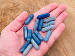 Blue aventurine terminated carved point gemstone, 33mm, with polished finish, from GemstoneGO, showcasing its vibrant blue color and natural patterns.