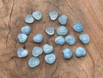 Aquamarine heart-shaped gemstone, 15x15x9mm, from GemstoneGO, showcasing its vibrant blue color and polished surface.