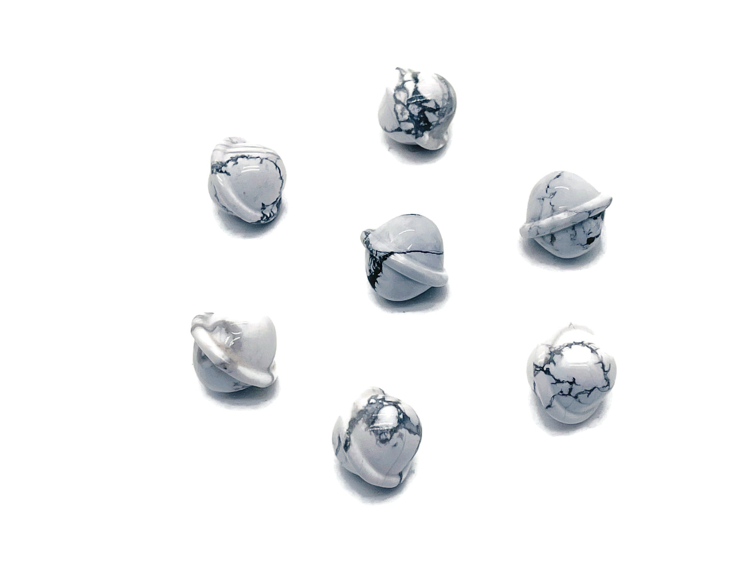 Mini Howlite Saturn crystal carved as a planet gemstone, 18mm, showcasing detailed planetary features and smooth surface.