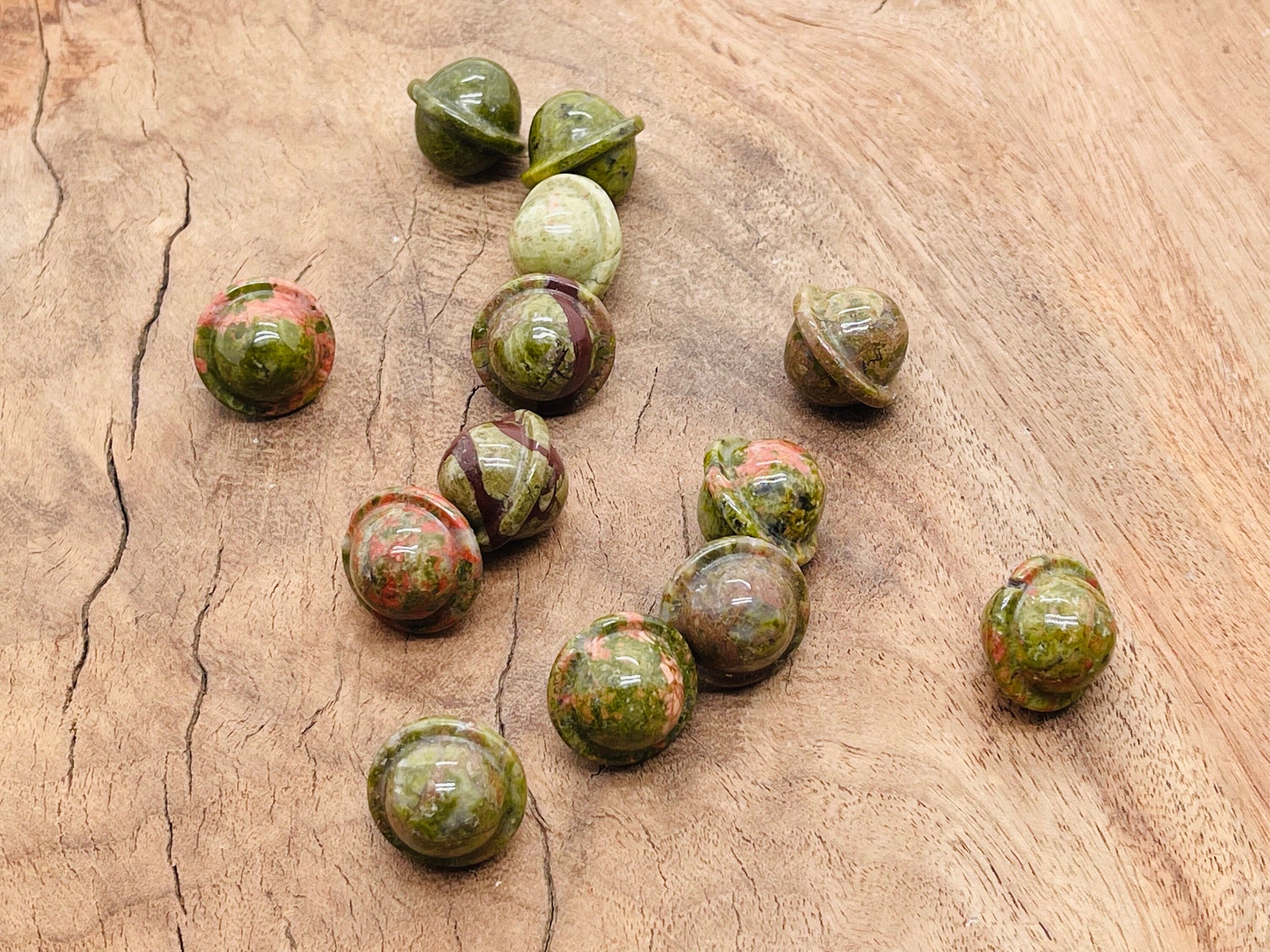 Unakite Saturn crystal carved gemstone mini planet, 18mm, showcasing detailed gemstone carving and natural pink and green stone colors.