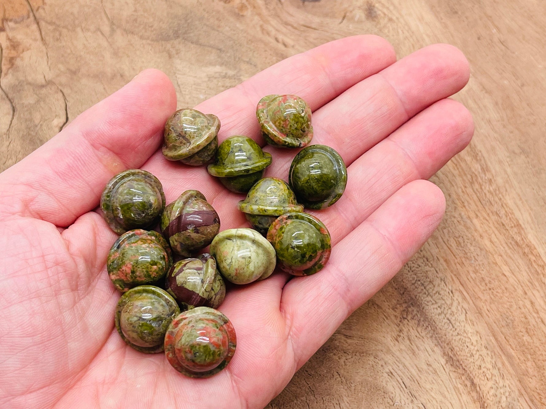 Unakite Saturn crystal carved gemstone mini planet, 18mm, from GemstoneGO, featuring detailed Saturn ring design and vibrant green and pink hues.