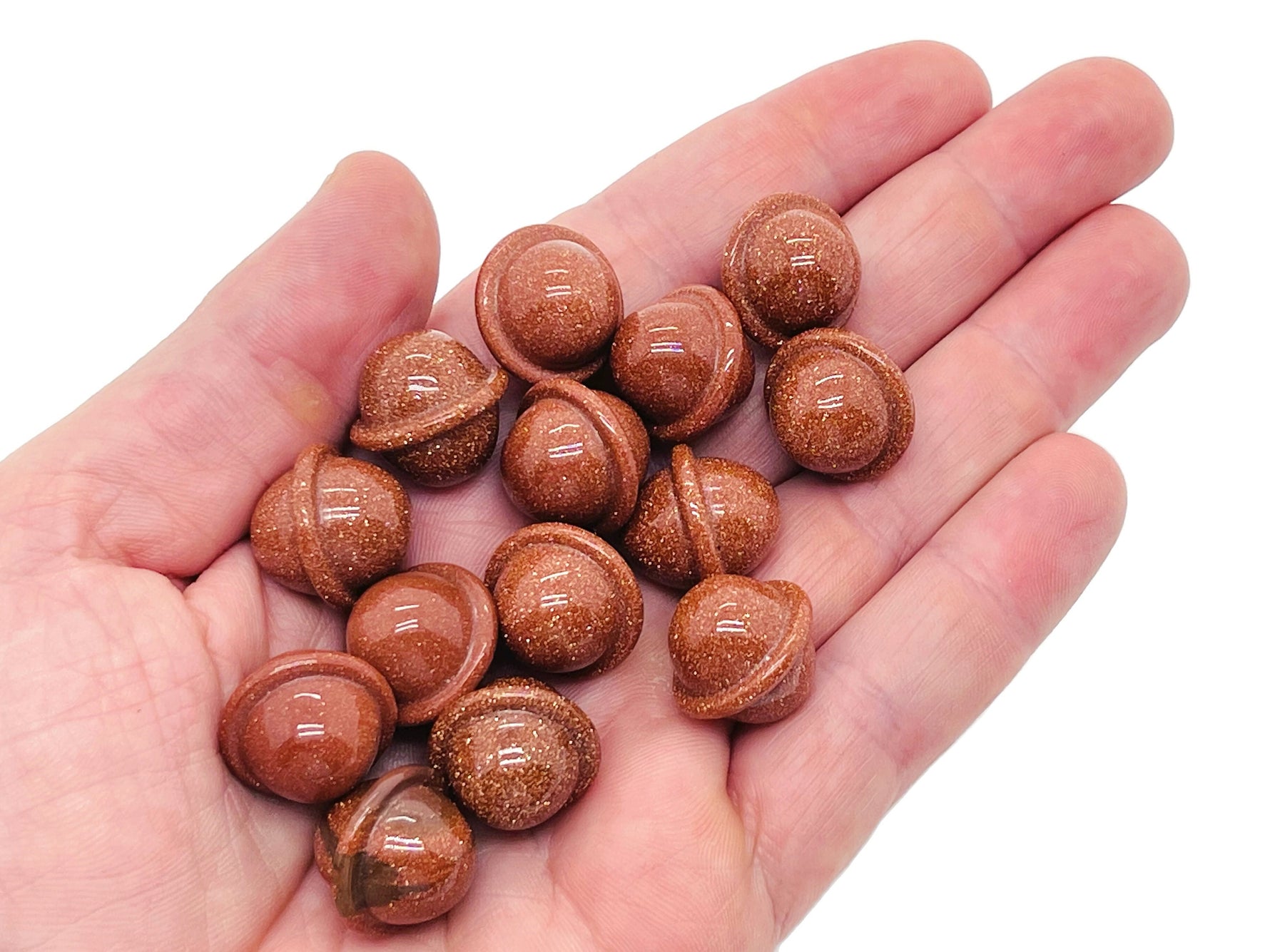 Goldstone Saturn crystal gemstone carved as a mini planet, 18mm size, featuring a detailed planetary design from GemstoneGO.