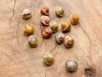 Mini Crazy Lace Agate Saturn gemstone carved as a planet, 18mm, featuring intricate patterns and vibrant natural colors.