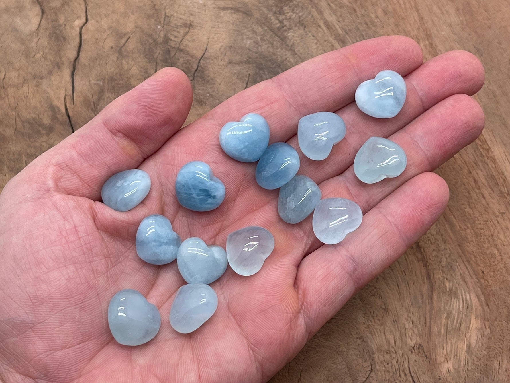Aquamarine heart-shaped gemstone, 15x15x9mm, from GemstoneGO, showcasing a vibrant blue faceted gem with a smooth heart shape.