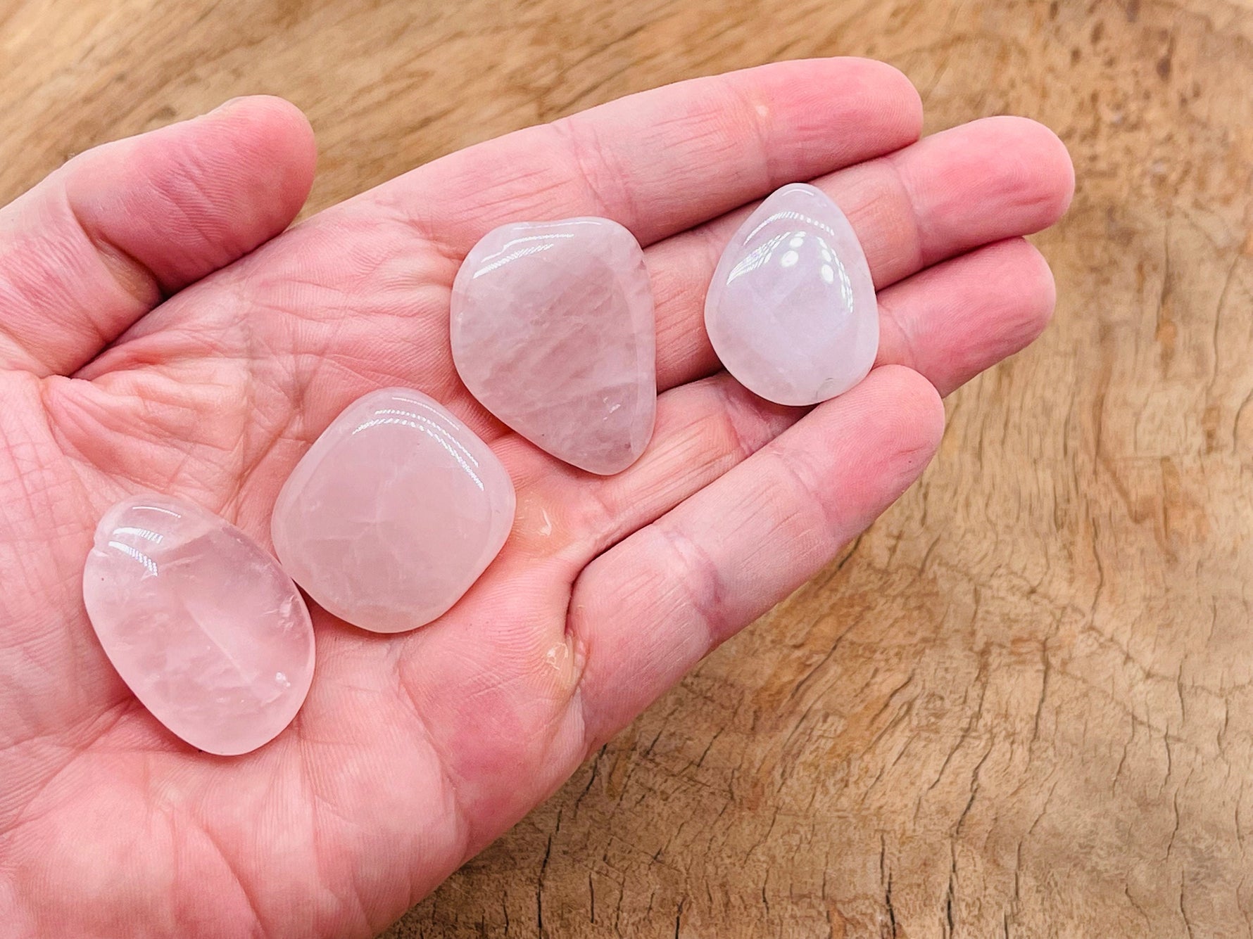 Rose Quartz flat gemstone slab from GemstoneGO, showing a smooth, polished pink crystal with natural stone patterns.