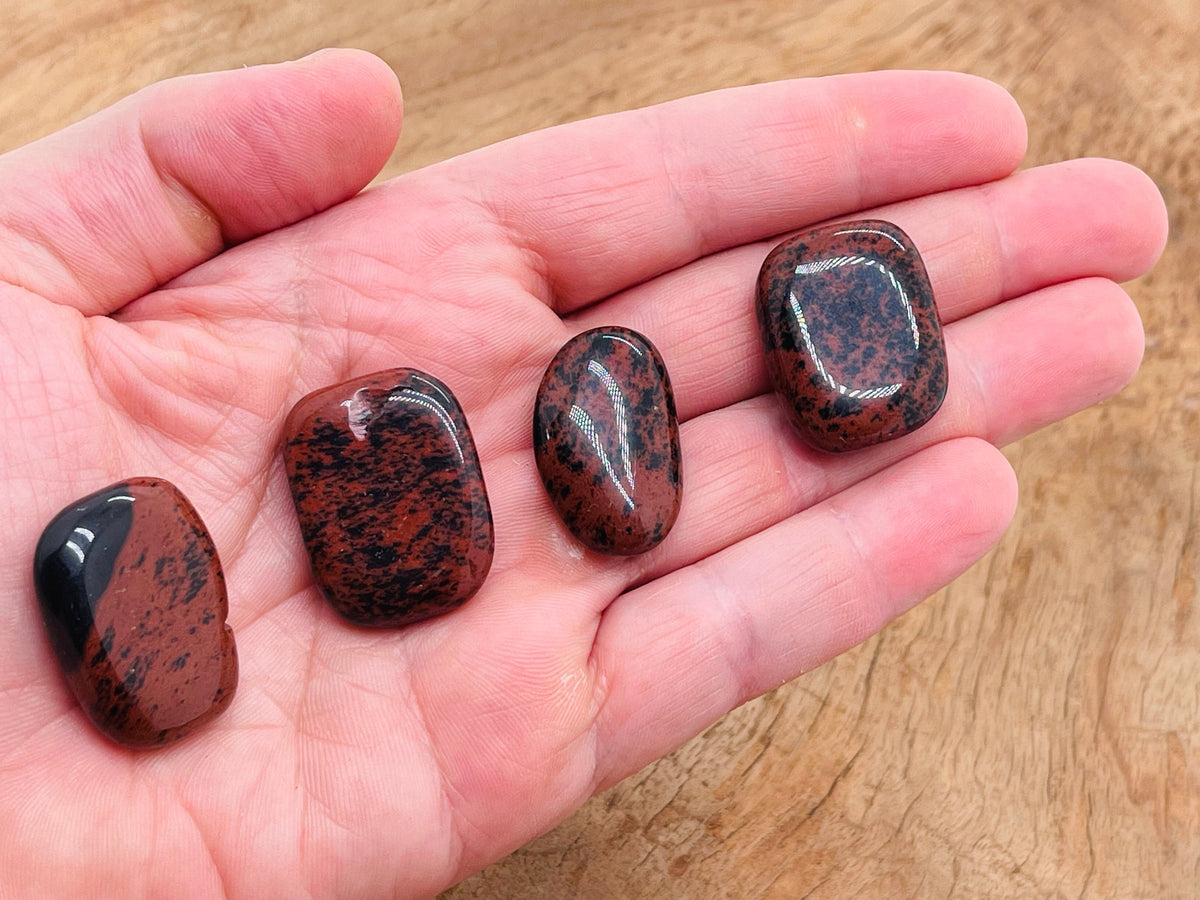 Mahogany Obsidian flat gemstone slab from GemstoneGO showing a polished, natural stone with rich reddish-brown and black patterns.