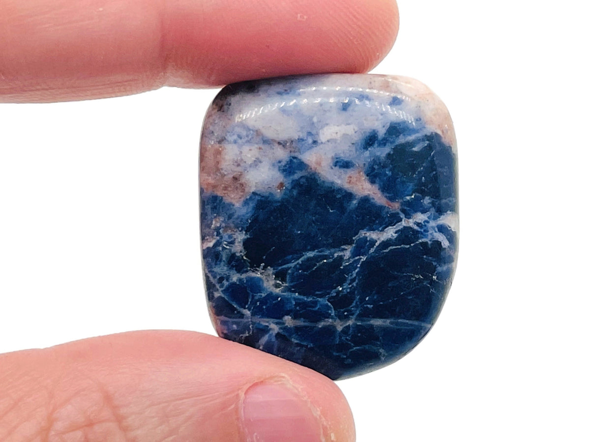 Sodalite flat gemstone slab crystal from GemstoneGO, showcasing deep blue and white mineral patterns on a smooth surface.