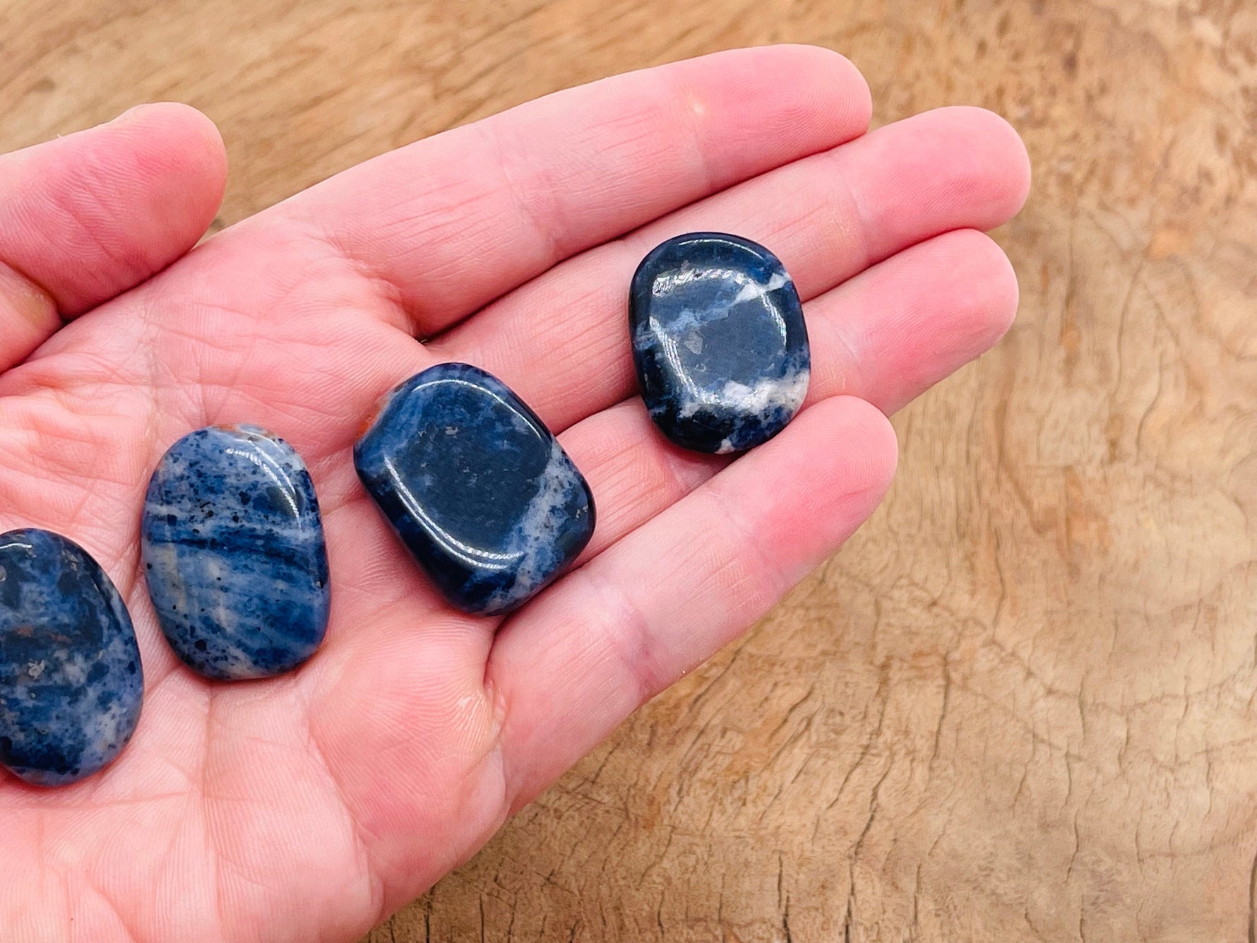 Sodalite flat gemstone slab from GemstoneGO showcasing vivid blue and white mineral patterns on a polished surface.