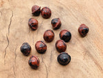 Mini mahogany obsidian Saturn gemstone carved as a planet, 18mm, with rich brown and black hues, from GemstoneGO.