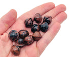 Mini mahogany obsidian Saturn crystal carved as a planetary gemstone, 18mm, from GemstoneGO featuring detailed planetary design.