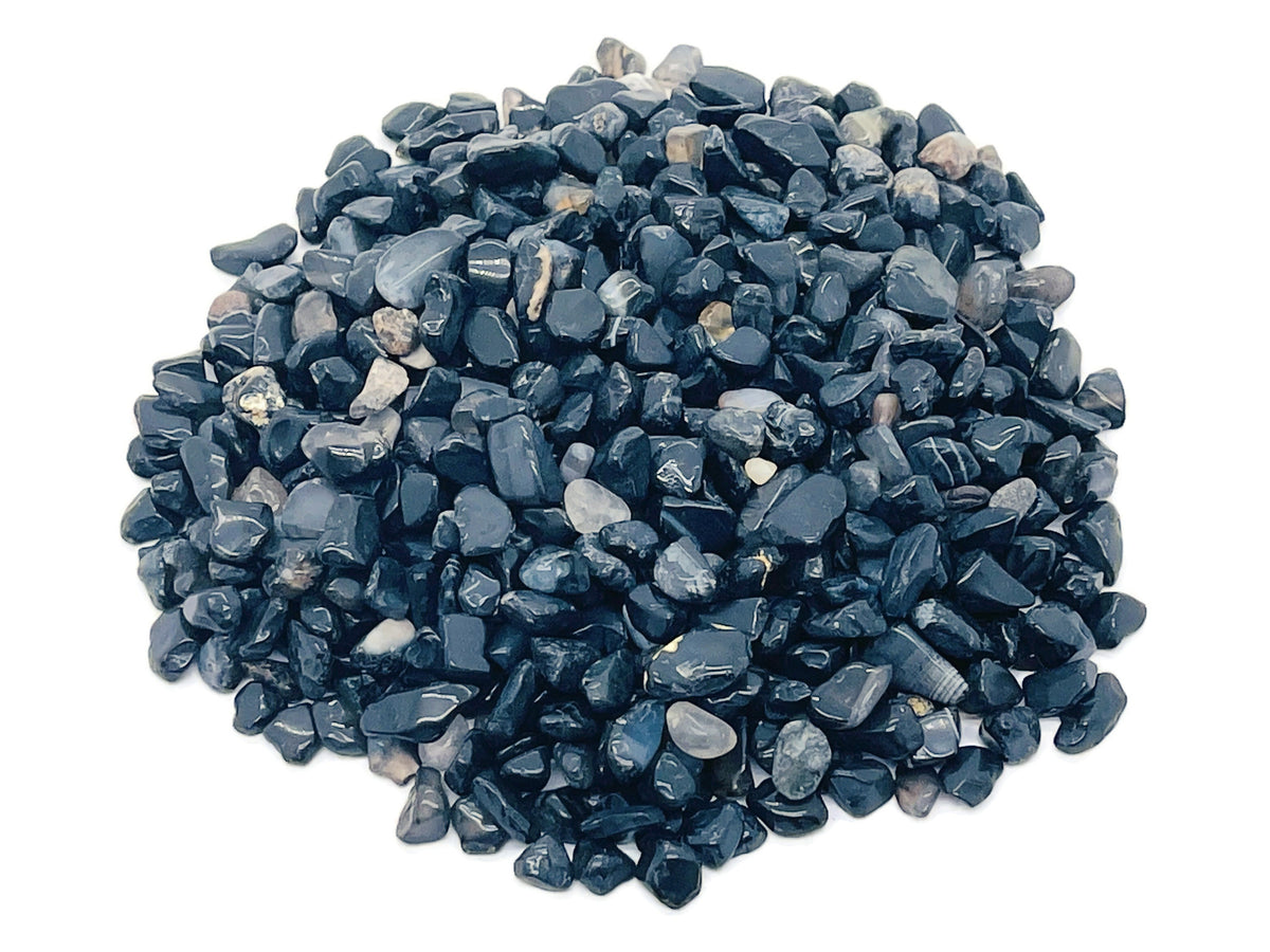 Black Agate crystal chips, semi-tumbled 5-8mm stones from GemstoneGO, shown in bulk with smooth, polished surfaces.