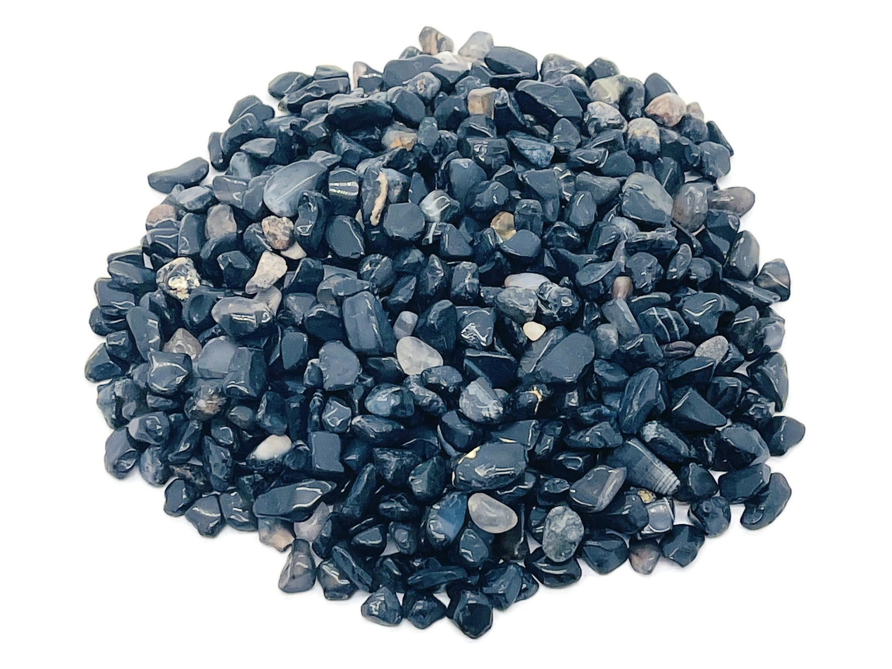 Black Agate crystal chips, semi-tumbled 5-8mm stones from GemstoneGO, shown in bulk with smooth, polished surfaces.