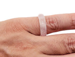 Rose Quartz crystal ring by GemstoneGO featuring a polished pink stone set in a silver band, displayed on a neutral background.