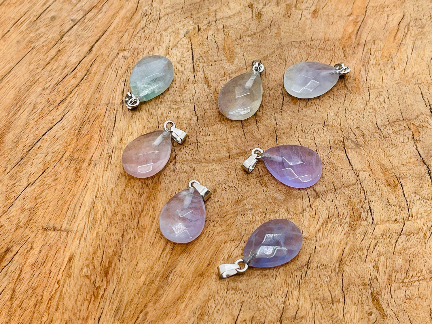 20mm Fluorite crystal pendant from GemstoneGO, showcasing vibrant green and purple hues, perfect for jewelry making supplies.
