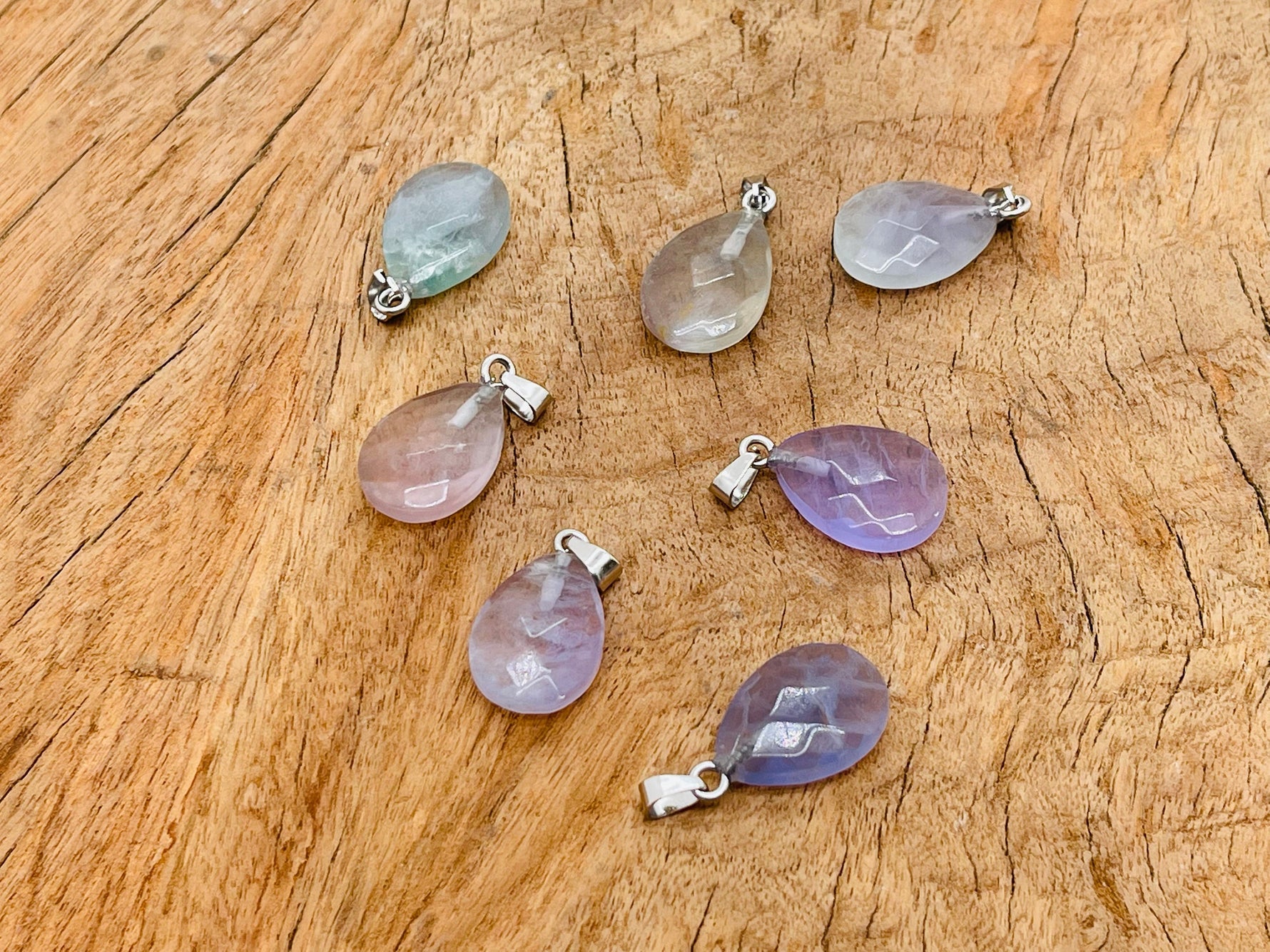 20mm Fluorite crystal pendant from GemstoneGO, showcasing vibrant green and purple hues, perfect for jewelry making supplies.